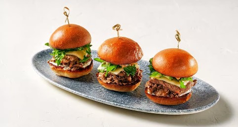 <who>Photo credits: Earls</who>Roast beef sliders, top, and yuzu calamari, below, are also new on the menu.