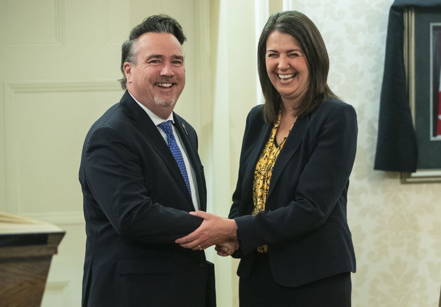 <who> Photo Credit: Canadian Press</who> Dale Nally shakes hands with Alberta Premier Danielle Smith after Nally was sworn into cabinet as Minister of Service Alberta and Red Tape Reduction in Edmonton, Monday, Oct. 24, 2022.