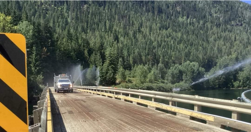 <who> Photo Credit courtesy of Sugar Lake Cherryville Bistro & Lodge </who> A view of sprinkler protecting a bridge near Sugar Lake.