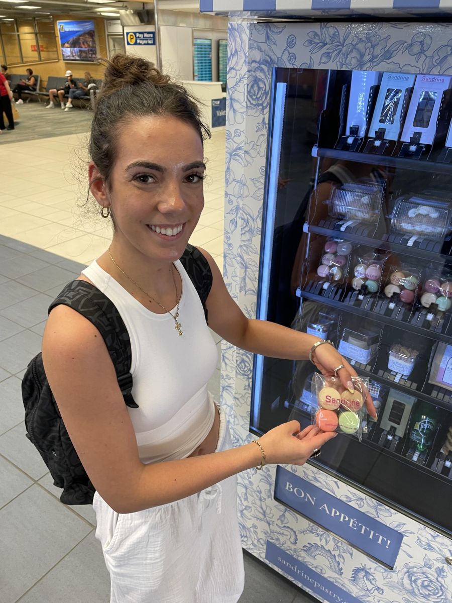 <who>Photo credit: Steve MacNaull/NowMedia Group</who>Kaily arrived from Calgary and prompted purchased a four-pack of macarons from the bakery ATM.