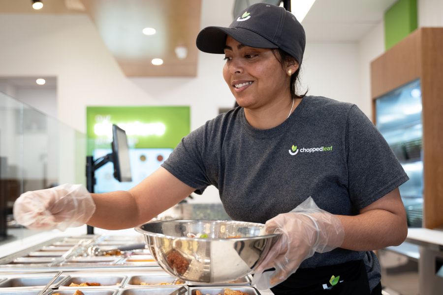 <who>Photo credit: Chopped Leaf</who>The new logo is also incorporated into all team member uniforms.