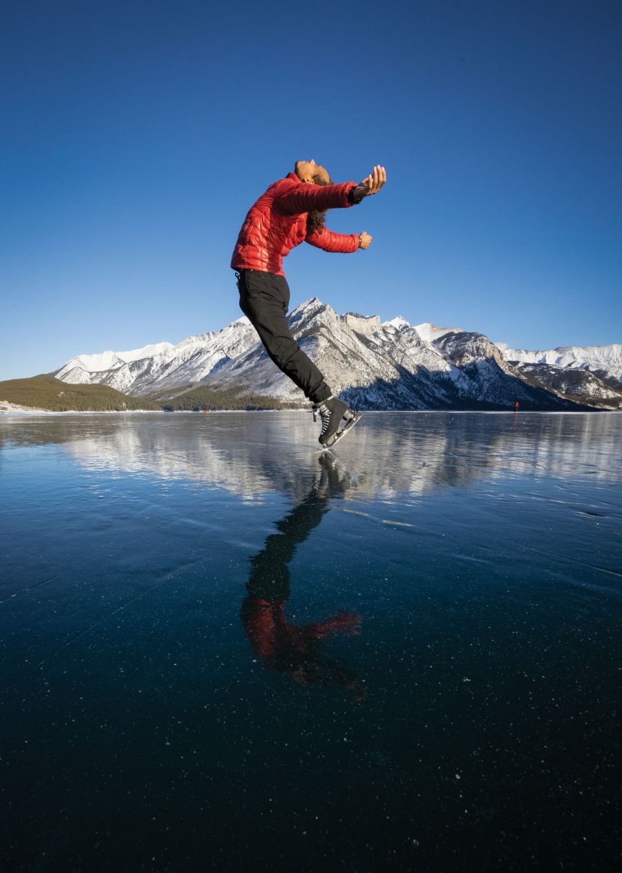 <who>Photo credit: Paul Zizka</who>Elladj Balde has become a social media sensation for inventive skating on see-through ice on frozen lakes.