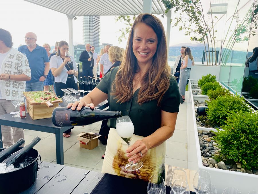 </who>Marketing director Joanna Schlosser pours the Ailm Estate Brut at 'An Elevated Affair' on the rooftop of The Block office tower in downtown Kelowna.