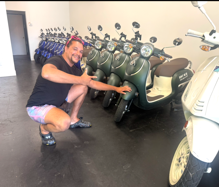 </who>Kelowna Scooters owner Craig Balentine welcomes American customers.