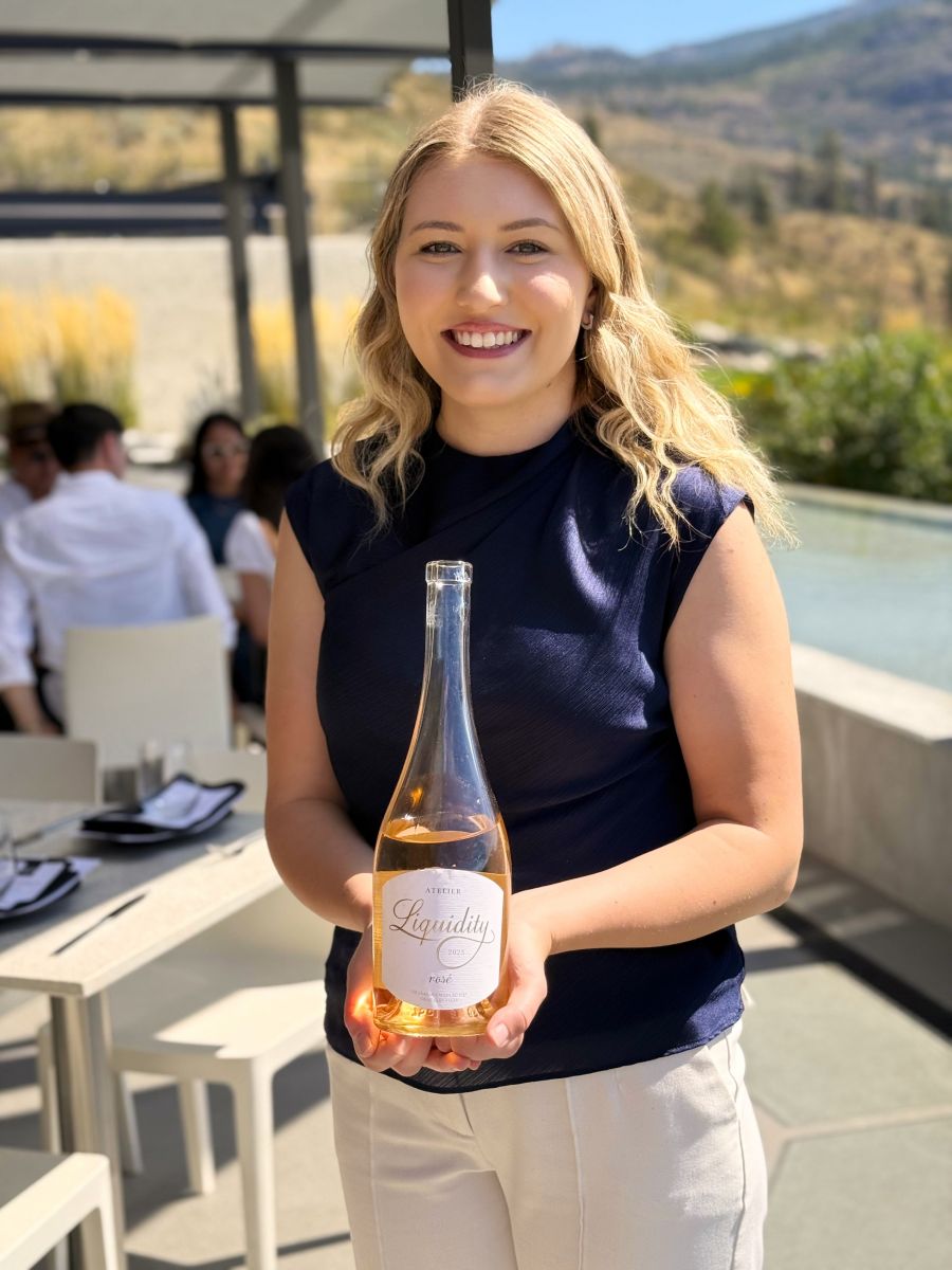<who>Photo credits: Steve MacNaull/NowMedia Group</who>The lead server from The Tapas Room at Liquidity Winery in Okanagan Falls, Claudia Couvillion, with the 2023 Atelier Rose ($50).