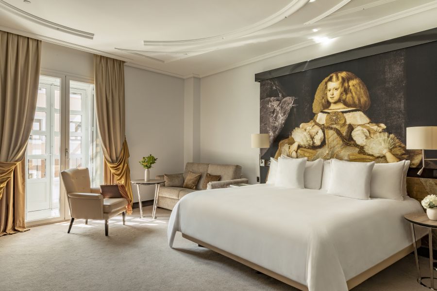 <who>Photo credit: Palacio de los Duques</who>Rooms at the Palacio de los Duques hotel feature fabric headboards on the beds with illustrations from Velazques masterpiece paintings.