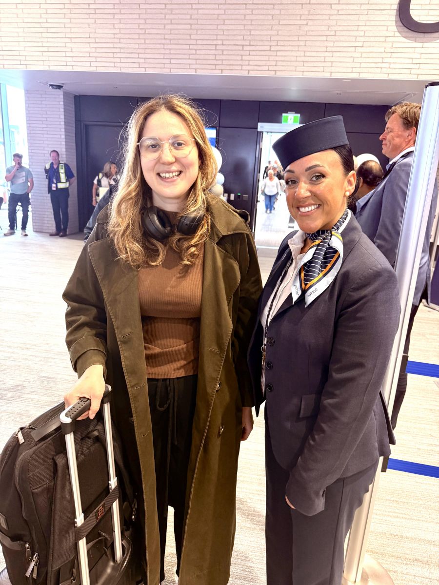 </who>Flight attendant Shannon Gowan, right, with the first passenger off the Ottawa-Kelowna flight, who did not want to give her name.
