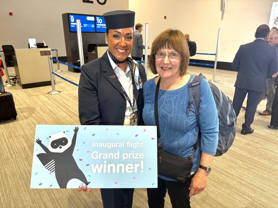 <who>Photo credits: Steve MacNaull/NowMedia Group</who>Porter flight attendant Shannon Gowan, left, with flights-for-two winner Judy Vos of Kelowna.