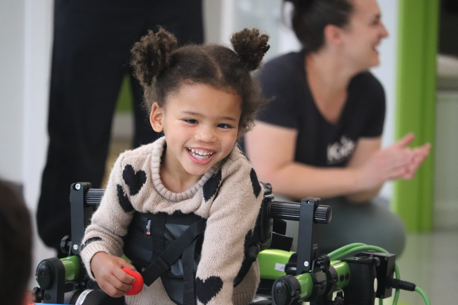 <who> Photo Credit: NowMedia/Corvin Vaski</who> Prescott with a big smile while walking around the clinic.