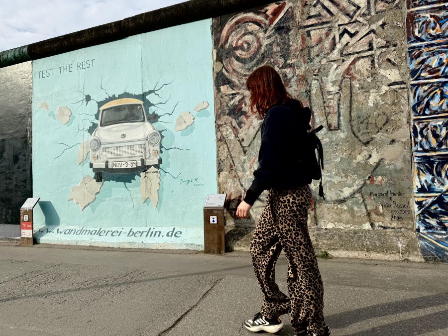 </who>The quirky little communist-era East German Trabi car has a mural dedicated to it on the Berlin Wall.