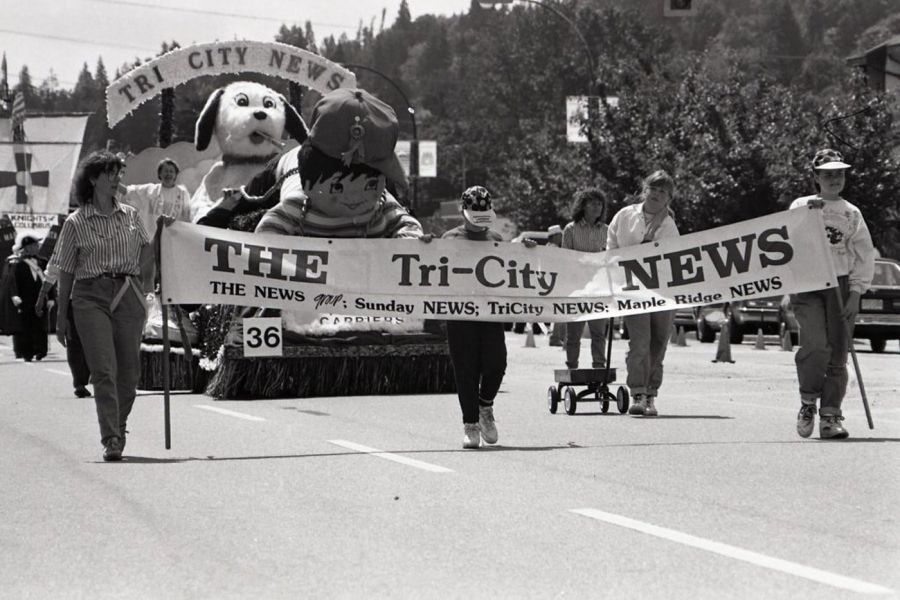 <who> Photo Credit: Mario Bartel/City of Coquitlam Archives</who>Tri-City News staff march in Coquitlam’s 1991 centennial parade.