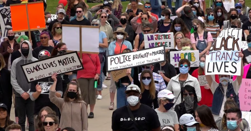 <who> Photo credit: KelownaNow </who> A file image showing a Black Lives Matter protest in Kelowna.