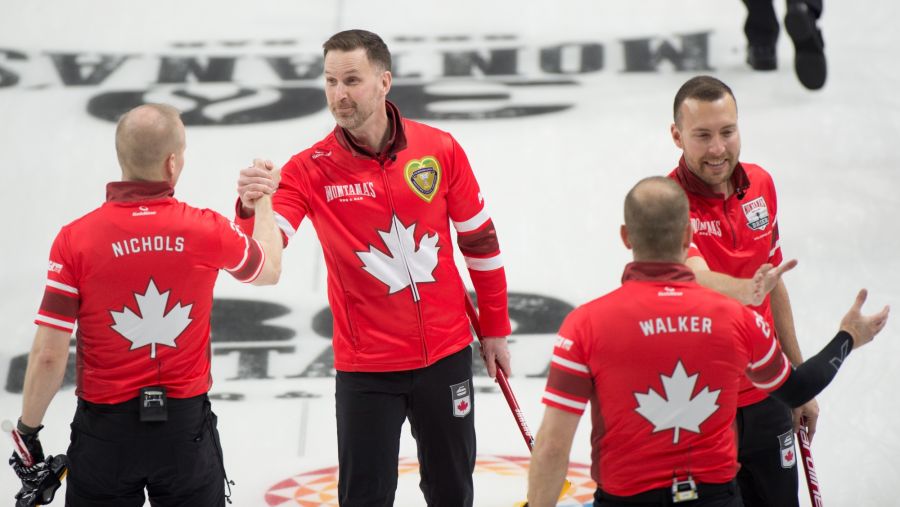 <who>Photo Credit: Curling Canada/Michael Burns</who>A businesslike Team Canada daps each other up after Friday's win.