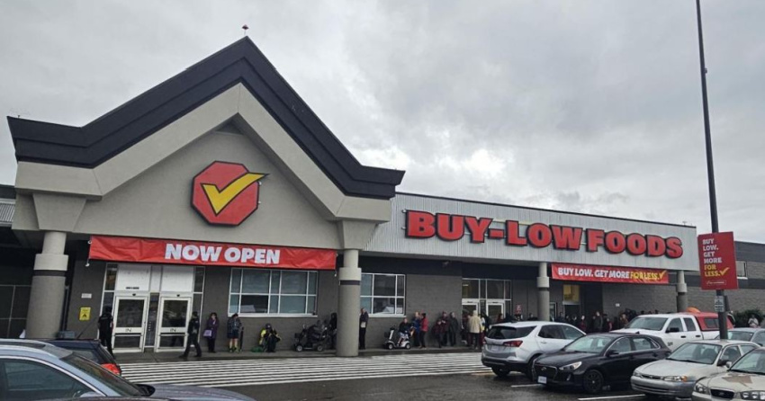 <who>Photo Credit: ImmediateTill</who>Customers line up outside the new Buy-Low Foods grocery store in Prince George hoping to score grand opening deals.