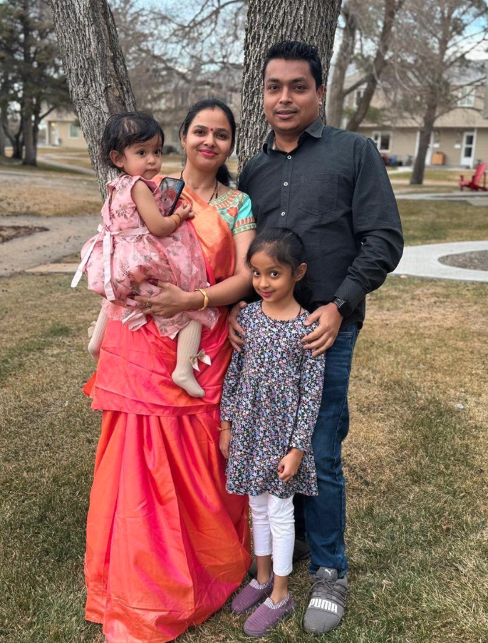 <who> Photo credit: Jatin Patel/Canadian Press </who> Piyushkumar Patel stands with his wife Ruchita, and their daughters in an undated handout photo.