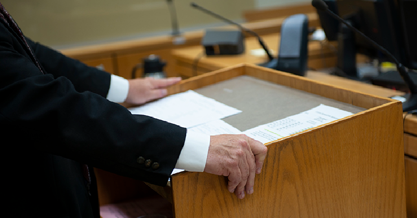 <who> Photo credit: John Deacon </who> A stock image showing a courtroom.