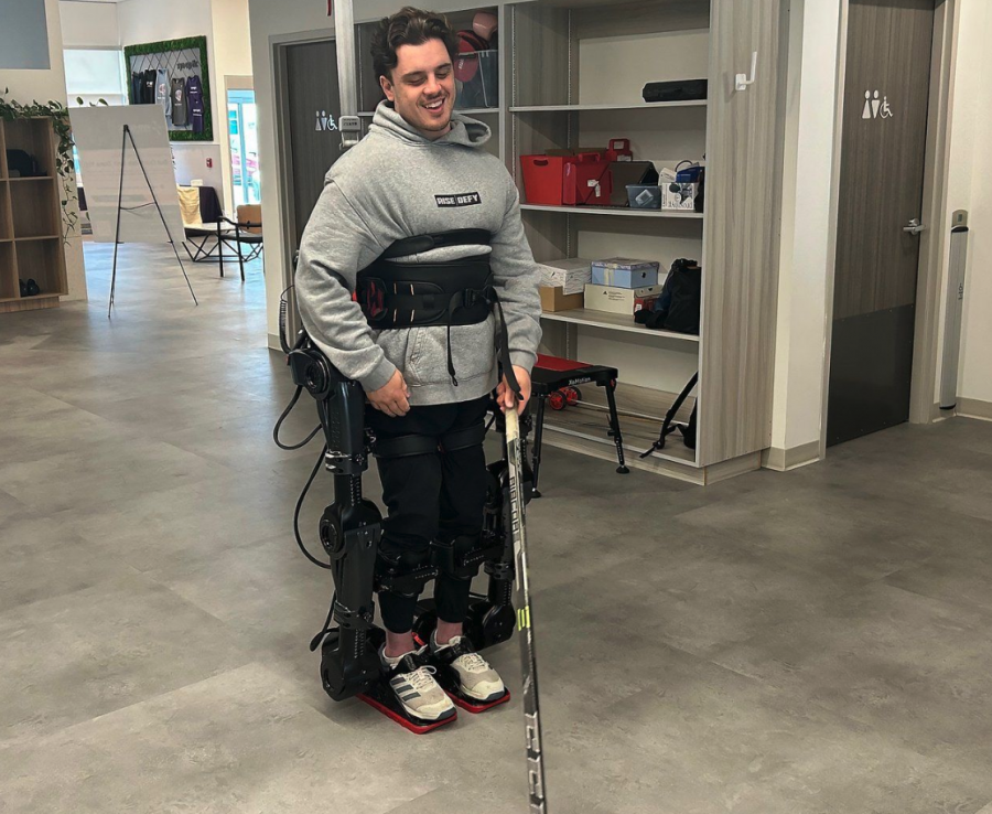 <who> Photo credit: Canadian Press </who> Former Humboldt Bronco Ryan Straschnitzki walks using a new exoskeleton in Calgary on Thursday June 12, 2025.