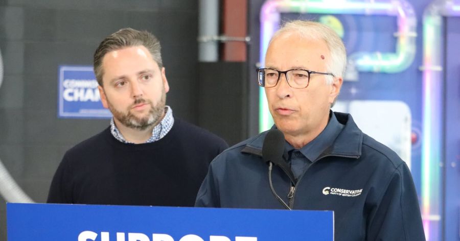 <who>Photo Credit: NowMedia</who>John Rustad speaks as Gavin Dew looks on during a Kelowna campaign stop in 2024.