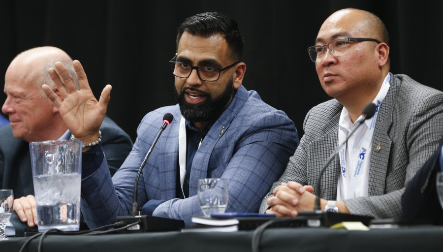 <who> Photo credit: Canadian Press </who> Manitoba PC MLA Obby Khan speaks at a Ministerial Bear Pit Session during the Progressive Conservative Party's annual general meeting at the convention centre in Winnipeg on Saturday, April 15, 2023. 