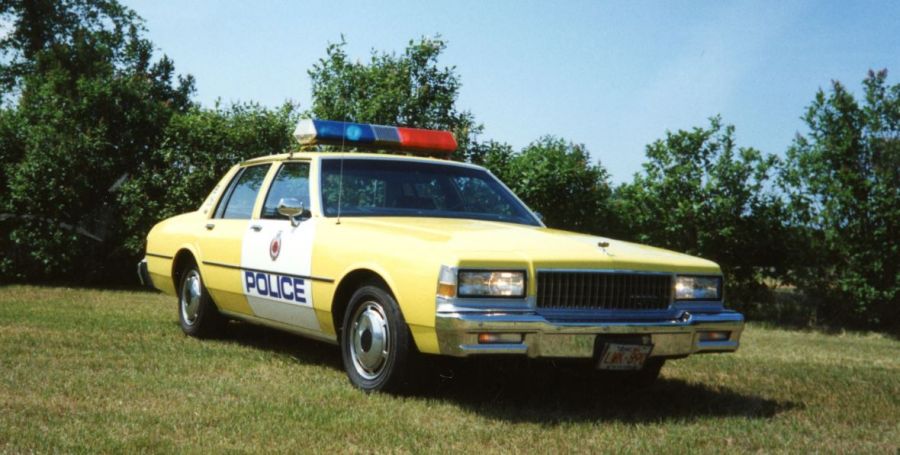 <who>Photo Credit: Edmonton Police/X</who>An old Edmonton police car.