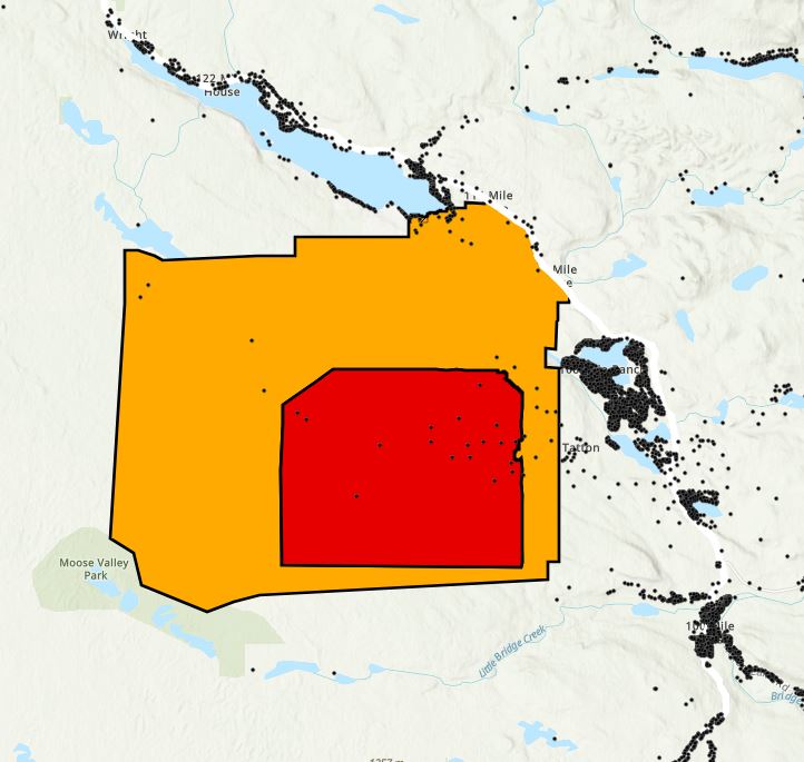 <who>Photo Credit: Cariboo Regional District</who>A map of the evacuation order (red) and alert with nearby properties identified with black dots.