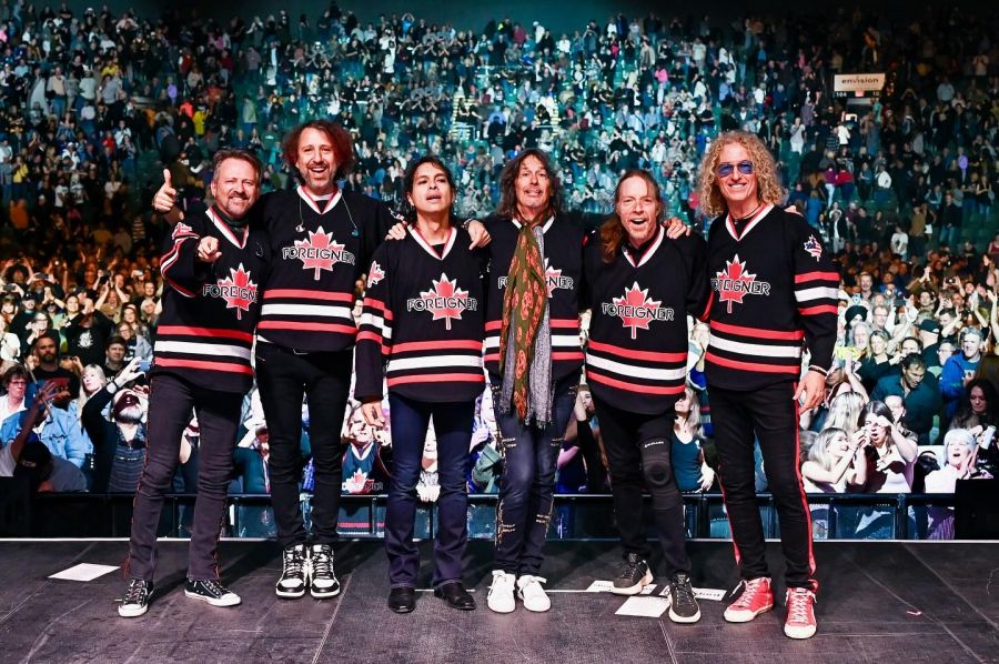 <who>Photo Credit: Foreigner/Facebook via Kamal Asar</who>Foreigner at a show in Abbotsford, BC, in 2024.