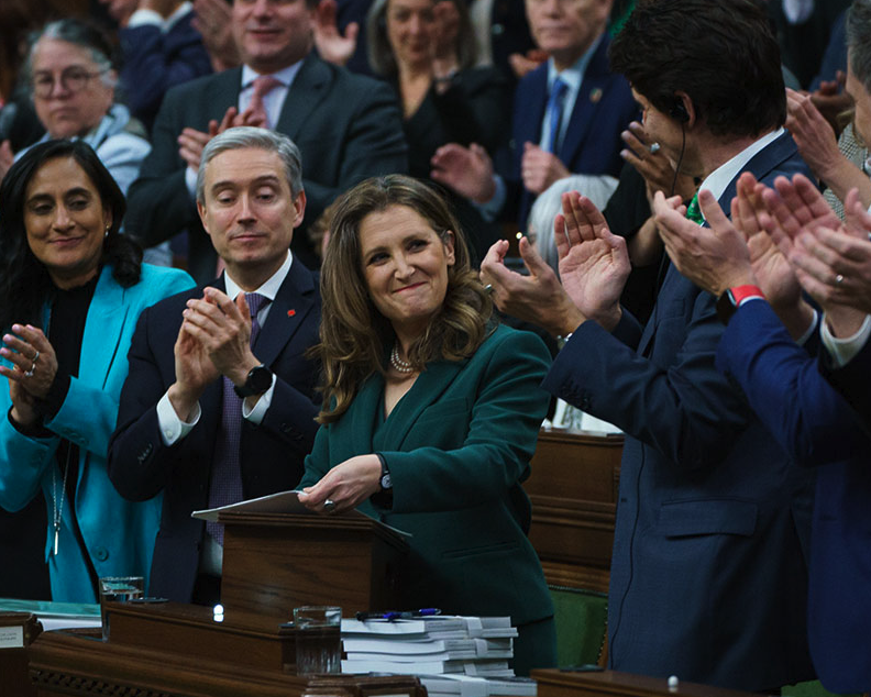 <who> Photo credit: Government of Canada </who> The finance minister delivering her budget.