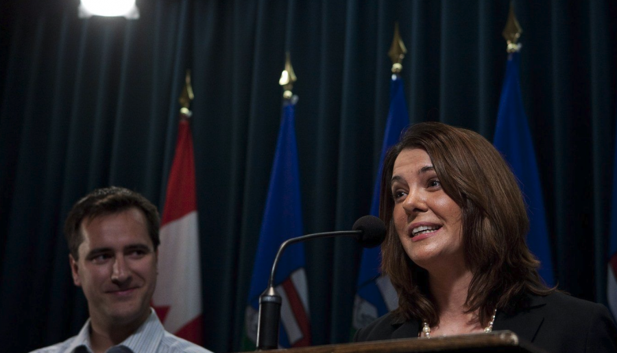 <who> Photo credit: Canadian Press </who> Alberta Premier Danielle Smith, right, speaks to reporters, as chief of staff Rob Anderson looks on in this file photo in Calgary, Alta., Wednesday, Jan. 26, 2011.