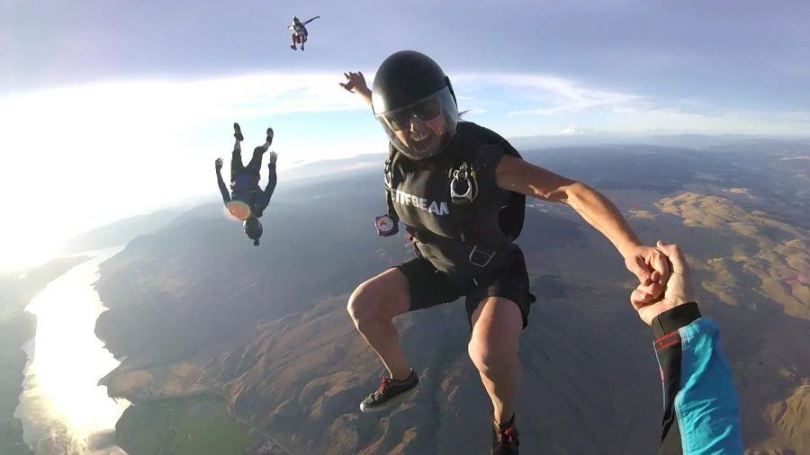 <who>Photo Credit: Bryan Grice via Katelyn Compton Escott Memorial/Facebook</who>Escott skydiving in 2017.