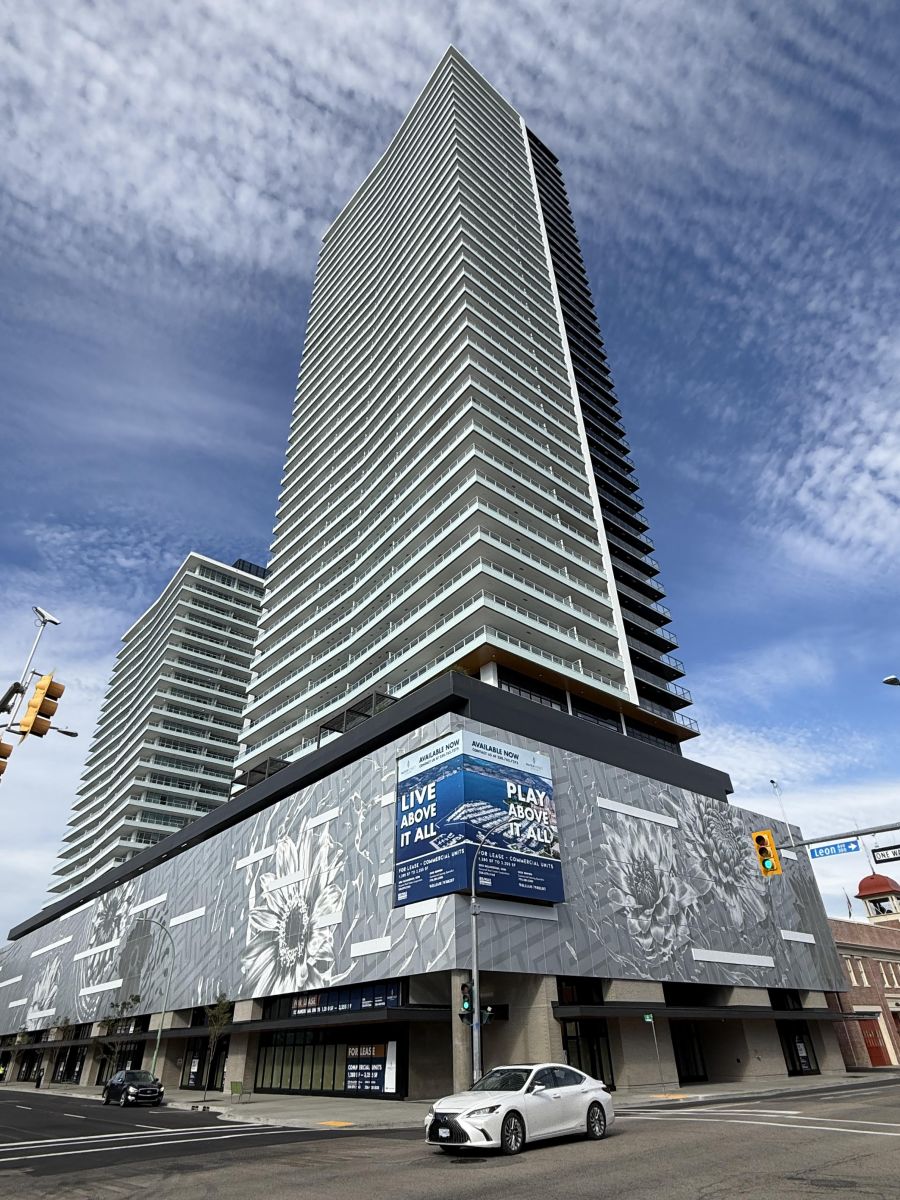 </who>The Eli uses the 'live above it all' tagline and features medal screening with Okanagan sunflower motifs covering four levels of parkade.