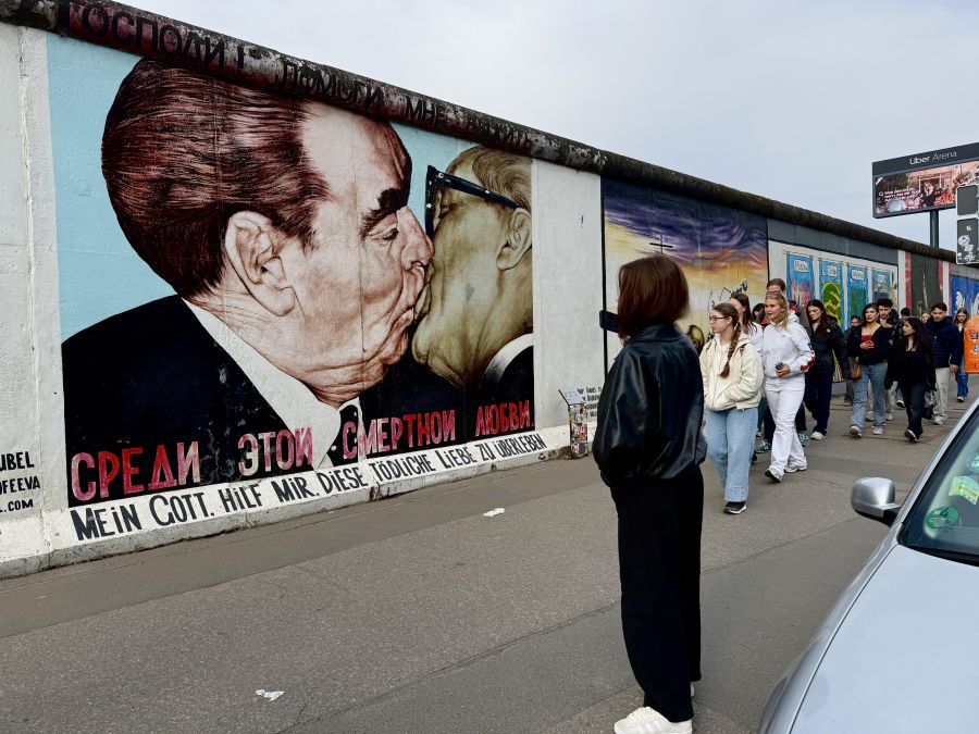 </who>The famous ‘communist kiss’ mural on the Berlin Wall.