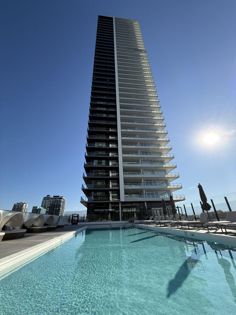 </who>The 6th floor pool and the 42-storey Eli.