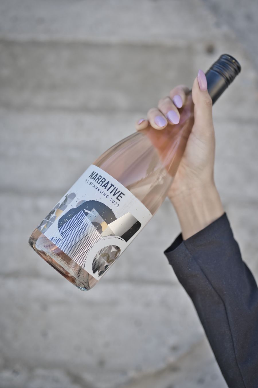 <who>Photo credit: Haywire Winery</who>Sparkling wine in a lightweight glass bottle with screw cap also reduces packaging and shipping costs.