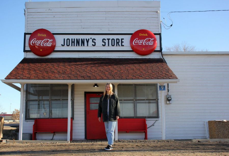 <who>Photo Credit: Canadian Press</who>Julie-Ann McNeilly in front of Johnny's Store