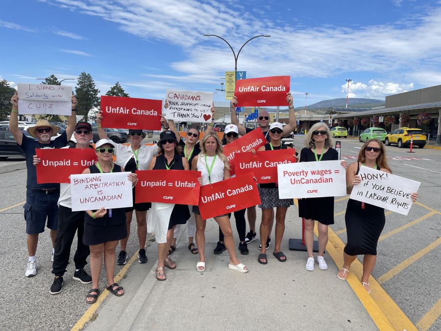 </who>Flight attendants picketed at Kelowna airport on Monday before the strike was settled overnight Monday and into Tuesday.