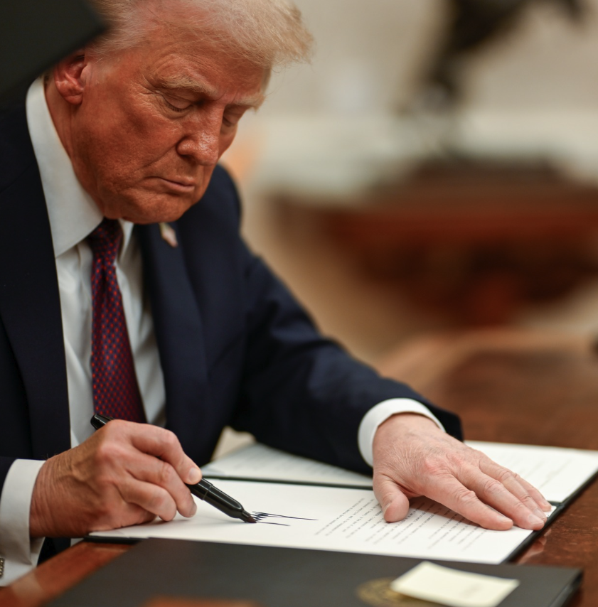 <who> Photo credit: The White House </who> Donald Trump signing an executive order last week.