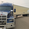 Semi-truck falls apart during u-turn, BC driver handed a ticket for falsified log books