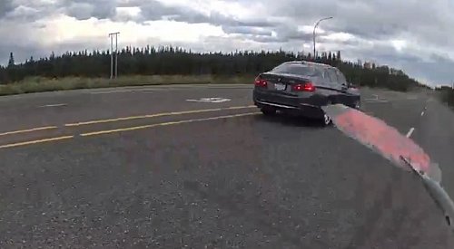 Distracted by cell phone, speeding Kelowna driver nearly hits cop on Hwy 97: BCHP